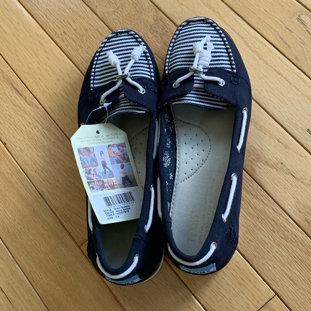 Toms women’s size 7.5 Quincy navy striped slip ons. New with tag. No box.